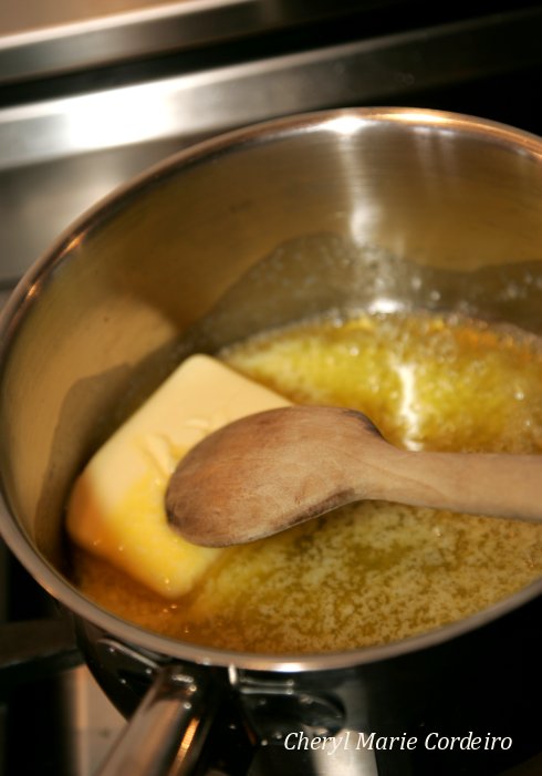 Melting butter for cinnamon rolls or kanelbullar.
