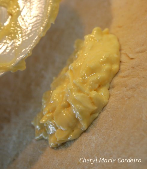 Melted butter onto the dough.